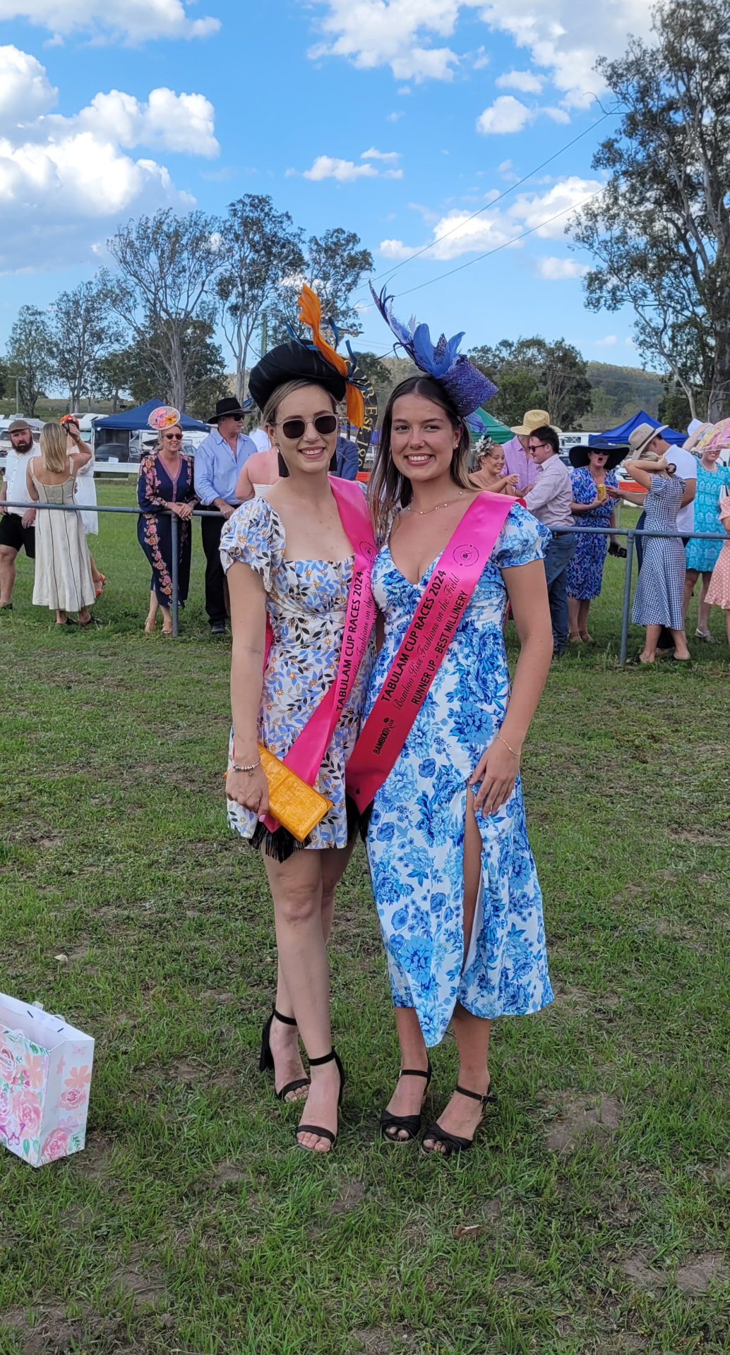 Millinery award winners in floral frocks at Tabulam