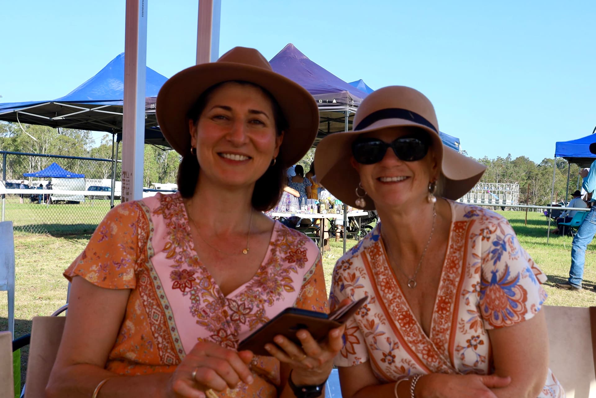 Friends in country hats enjoying the races