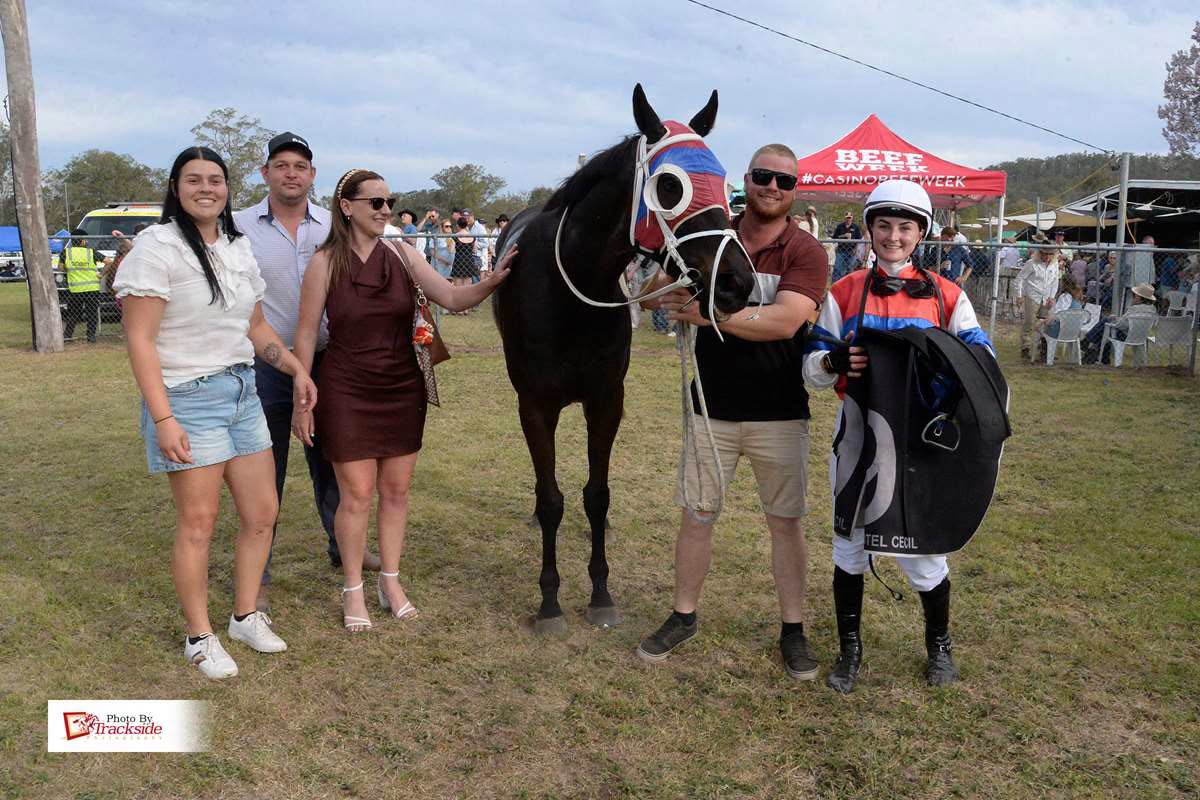 Connections and the jockey posing with the winner after a race at the Tabulam country races